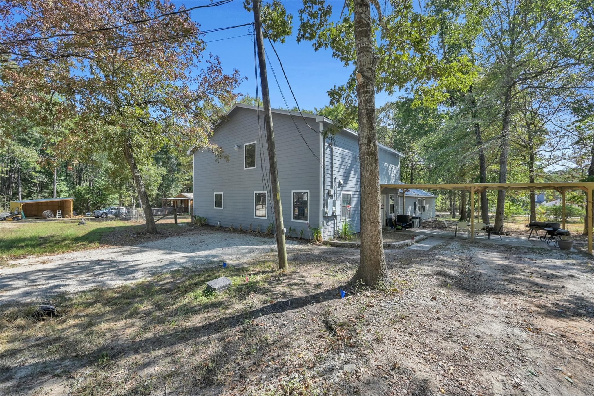 Welcome to 15876 Pecan Drive! This property wooded and unique.  Unit A's front entrance is on the left, and unit B is on the right with its own entrance. 3