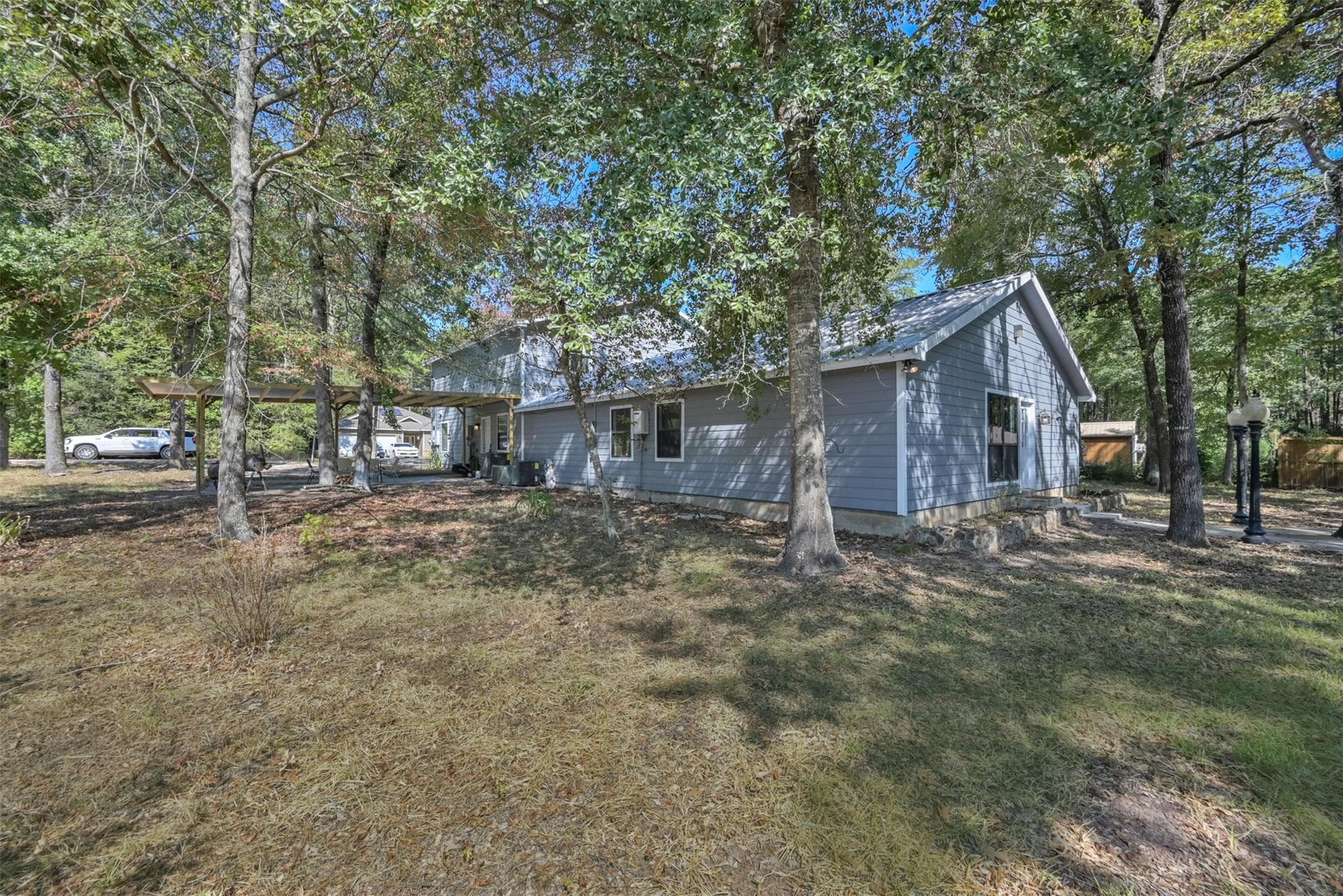 Welcome to 15876 Pecan Drive! This property wooded and unique.  Unit A's front entrance is on the left, and unit B is on the right with its own entrance.